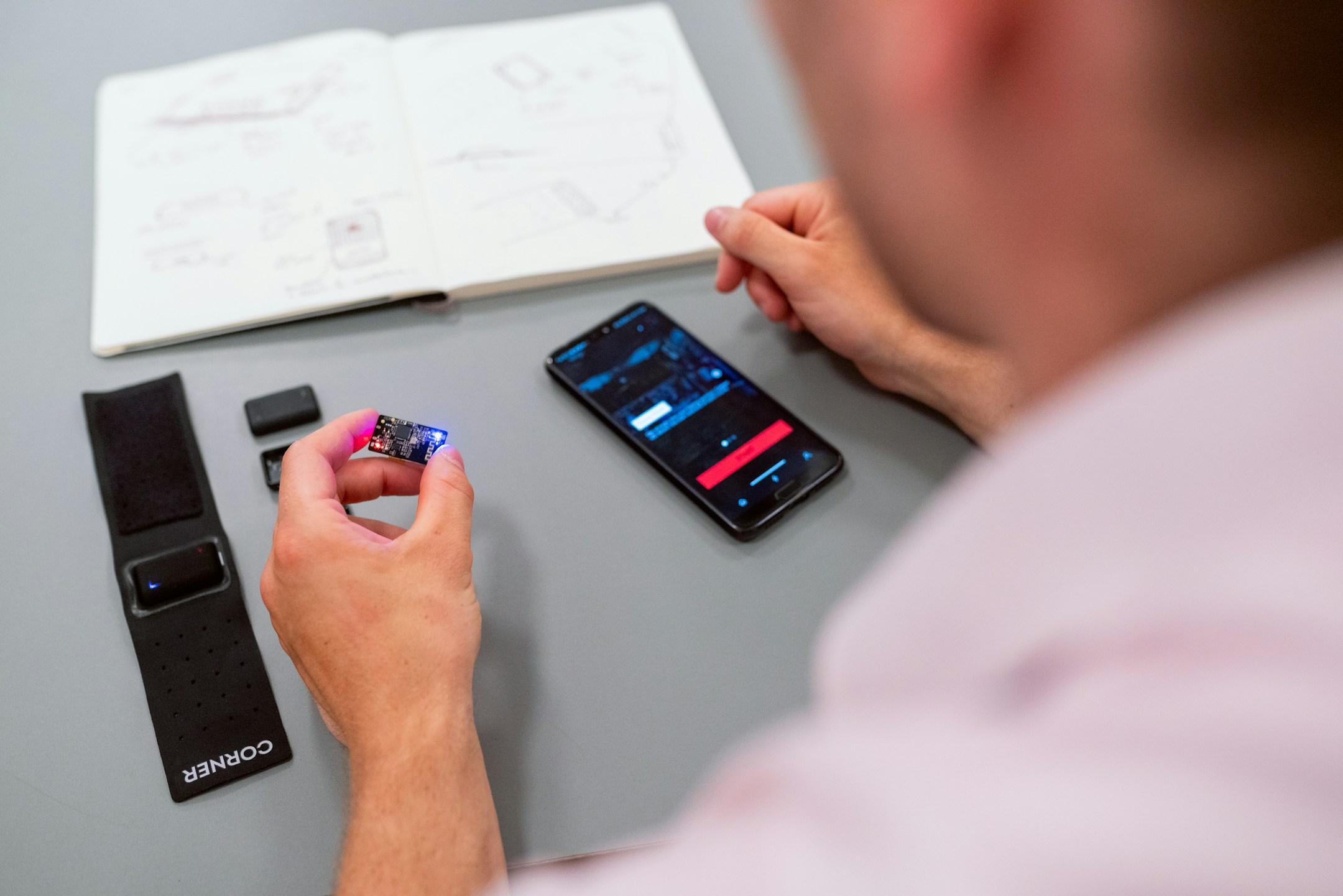 Male engineer with performance tracking device for boxing